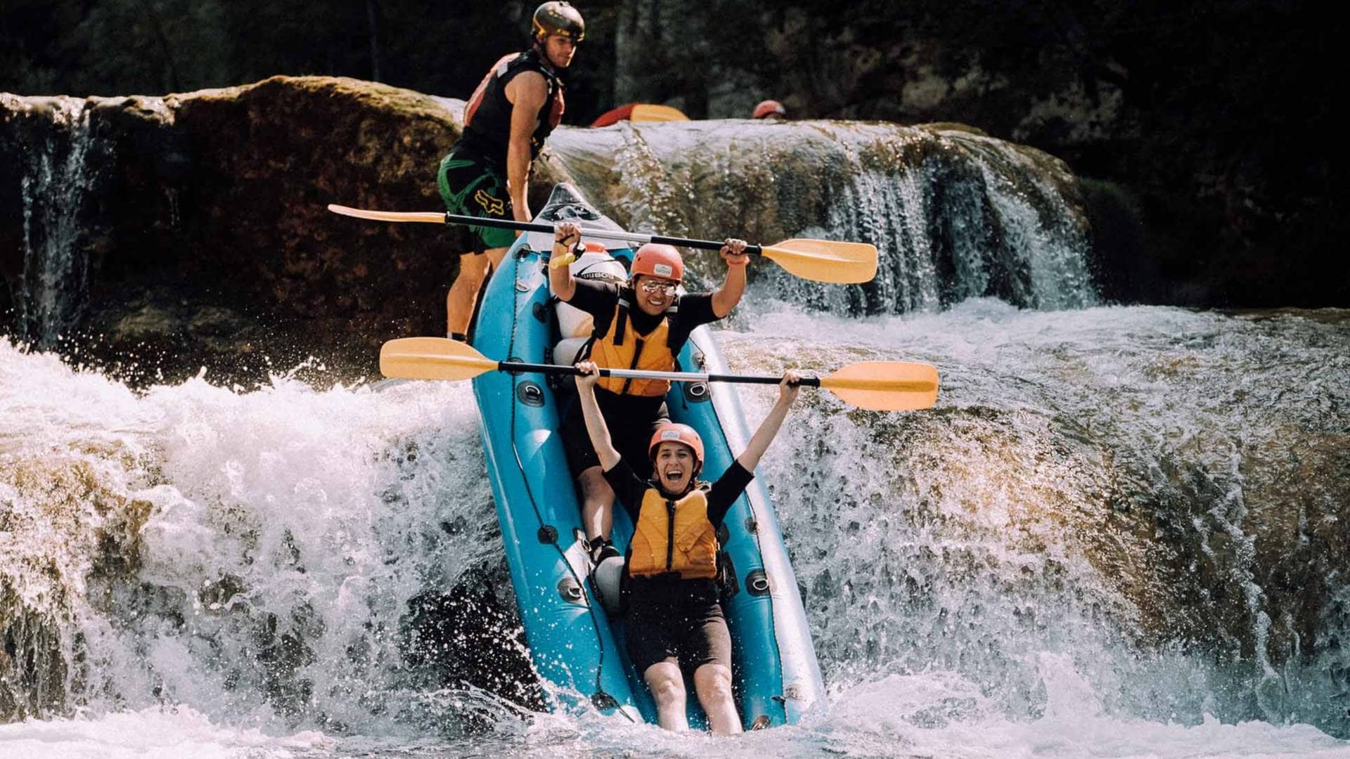 group of people white water rafting in croatia