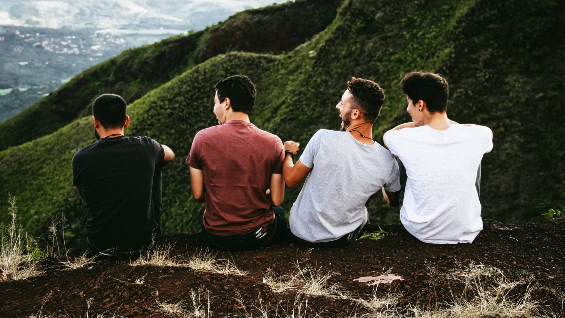 group of men having fun up a mountain