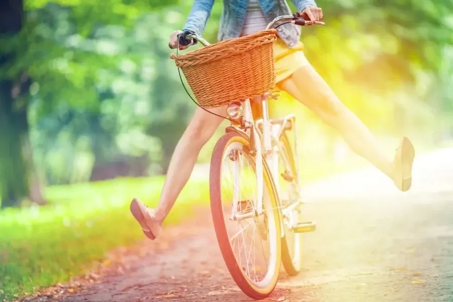 Girl riding a bike down the street