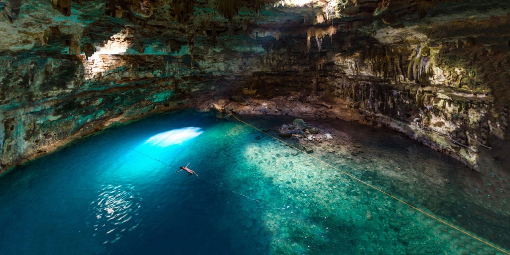 Someone swimming in the Yucatan Cenote