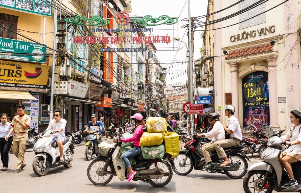 Motorbike riders in the streets of Hanoi