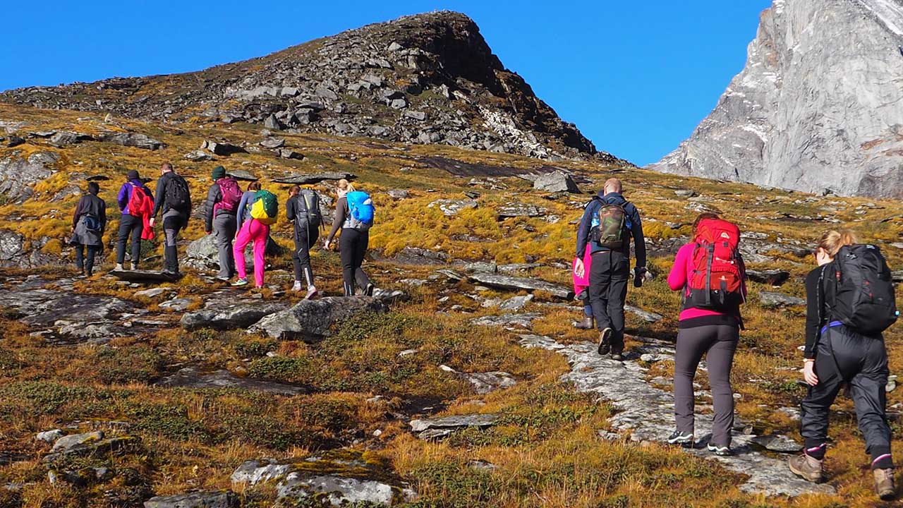 A group hiking through the Himalayas in Nepal