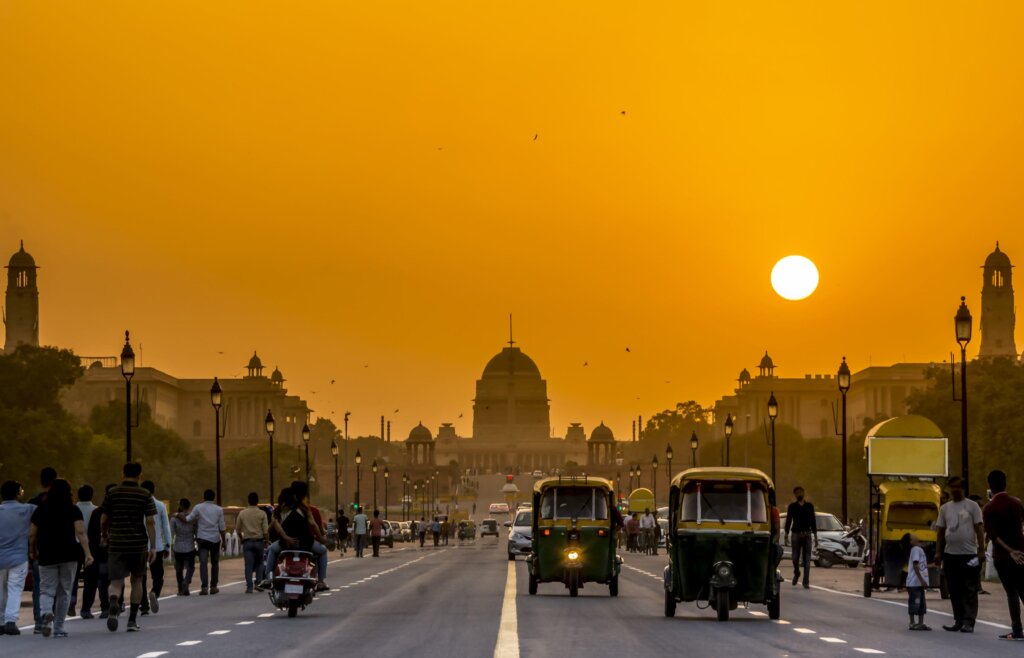 A busy avenue in Dehli leading up to the President’s Residence of Rashtrapati Bhavan at sundown