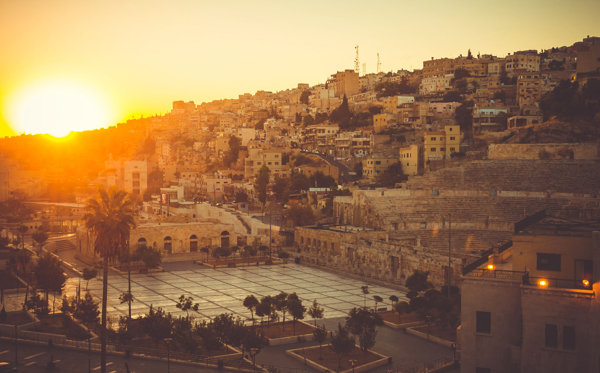 Sun rises over the city of Amman, Jordan