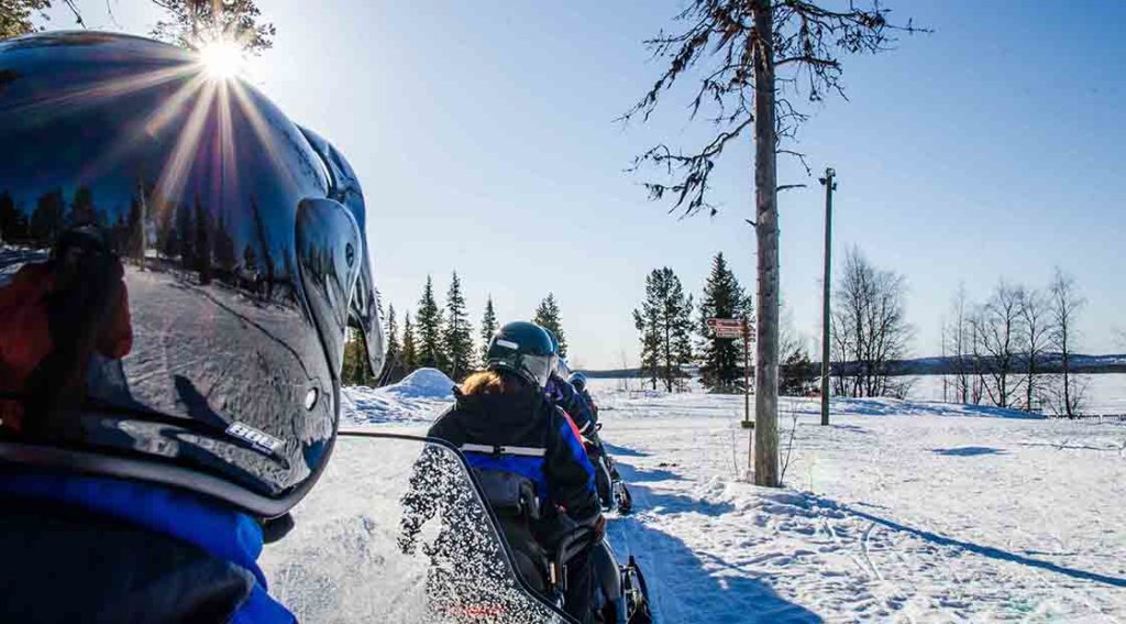 People on snowmobiles in Finnish Lapland
