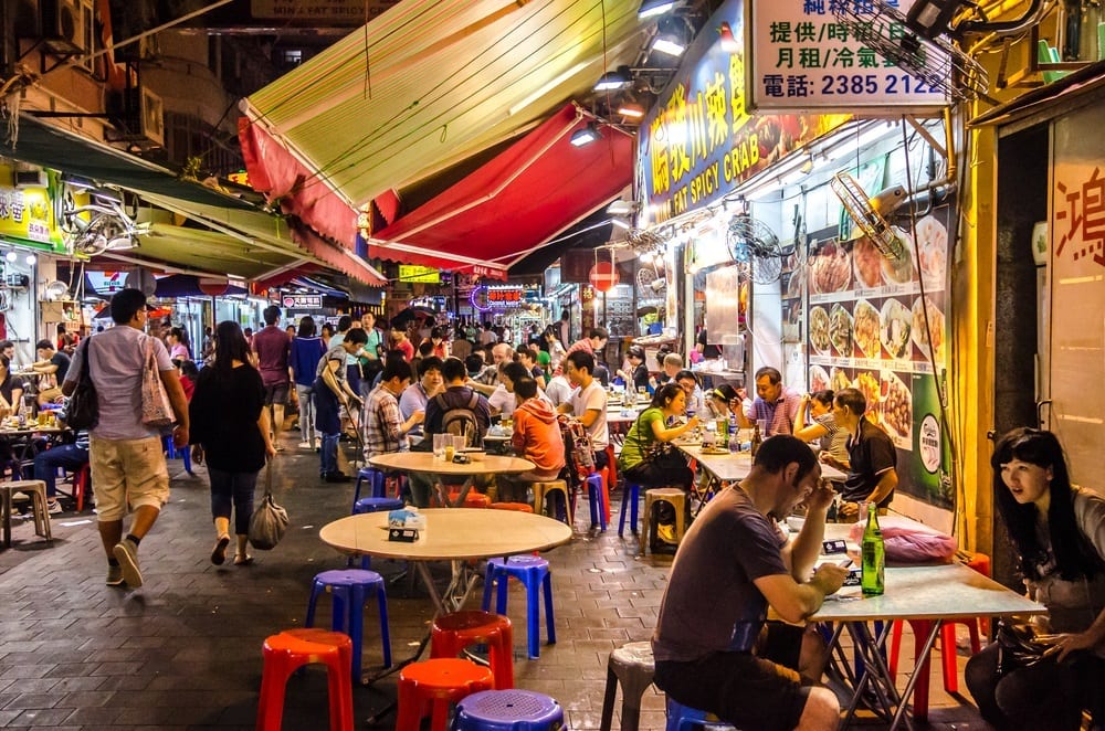 People eating at the Temple Street Night Market in Hong Kong