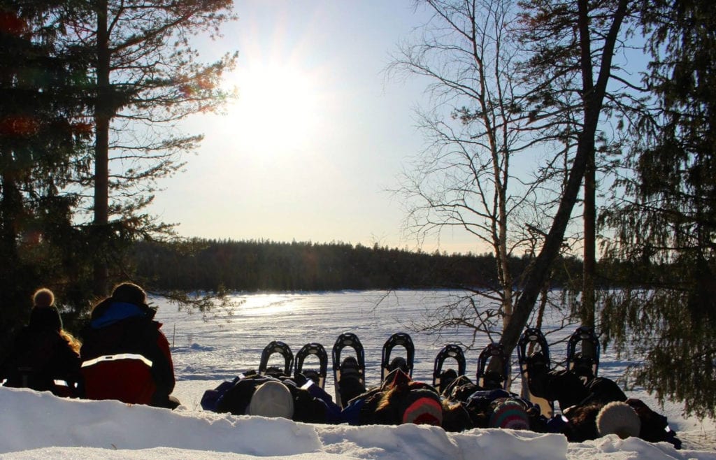 Flashpackers lying back in snow