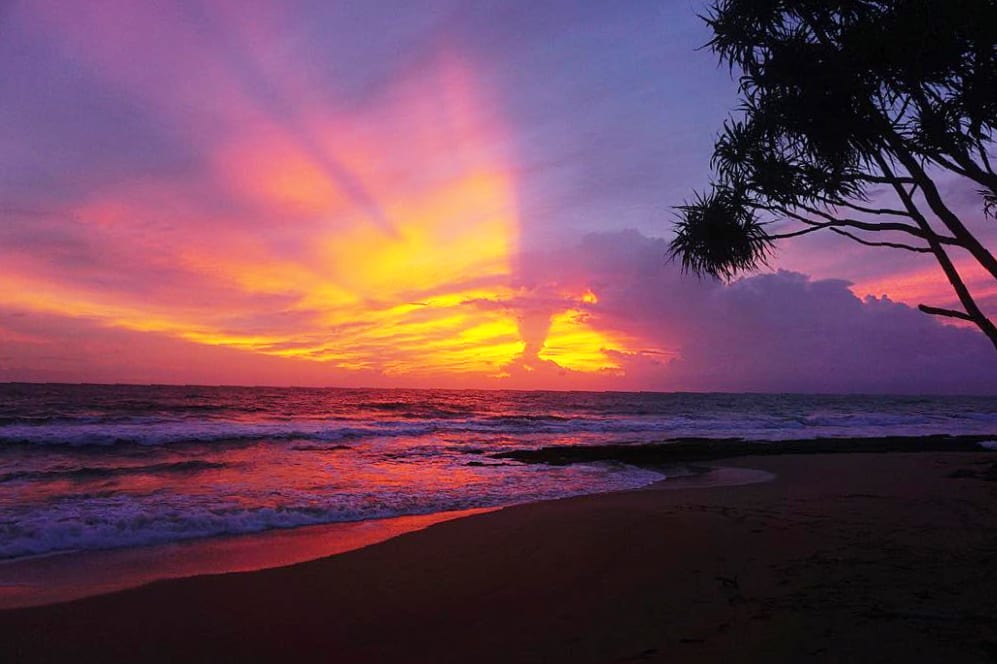 A red and pink sunset on a beach in Sri Lanka