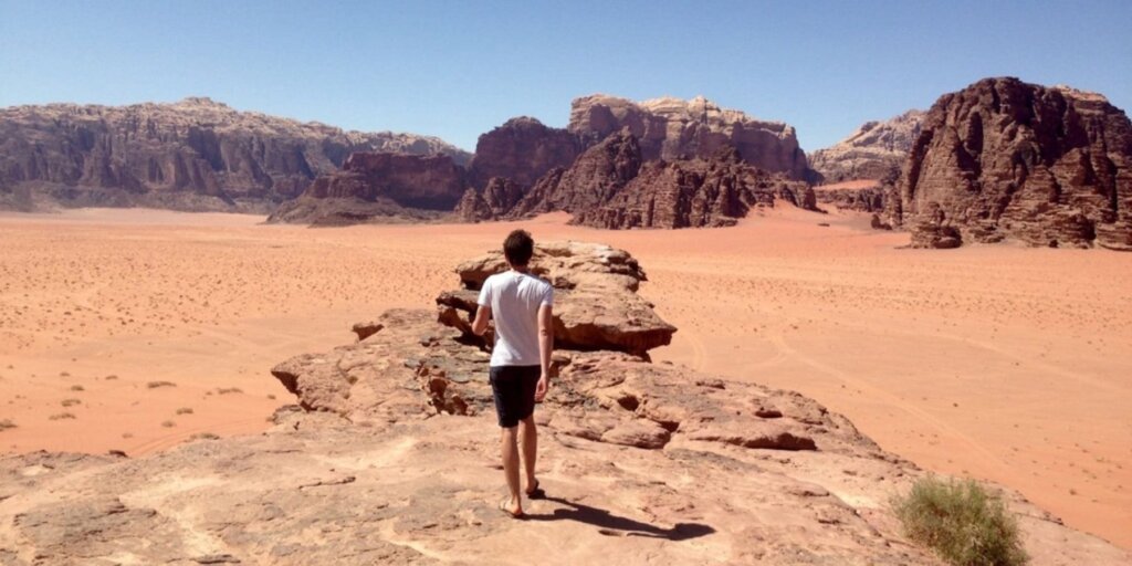 A man standing in Wadi Rum Protected Area in Southern Jordan