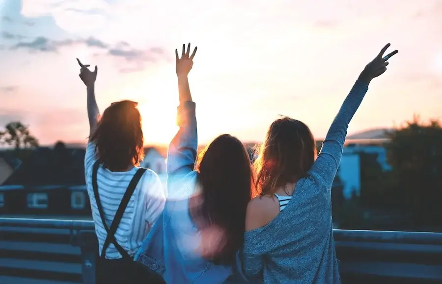three girlfriends celebrating