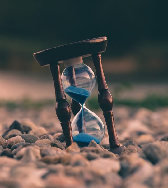 hour glass on pebble beach