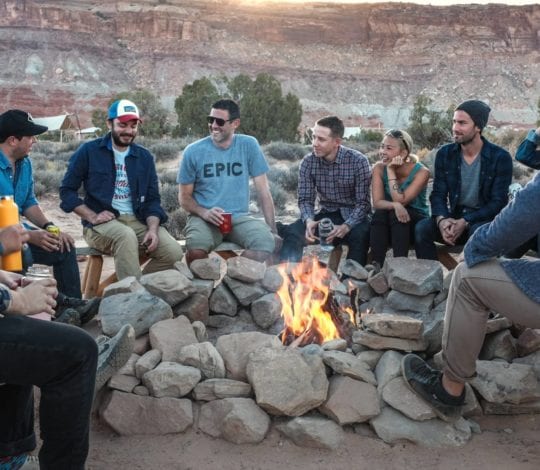 up of people around a camp fire