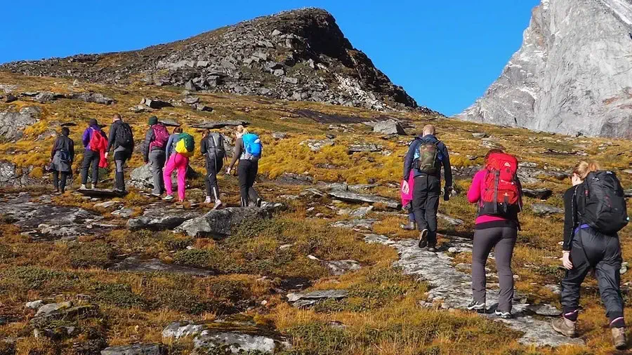 A group hiking through the Himalayas in Nepal