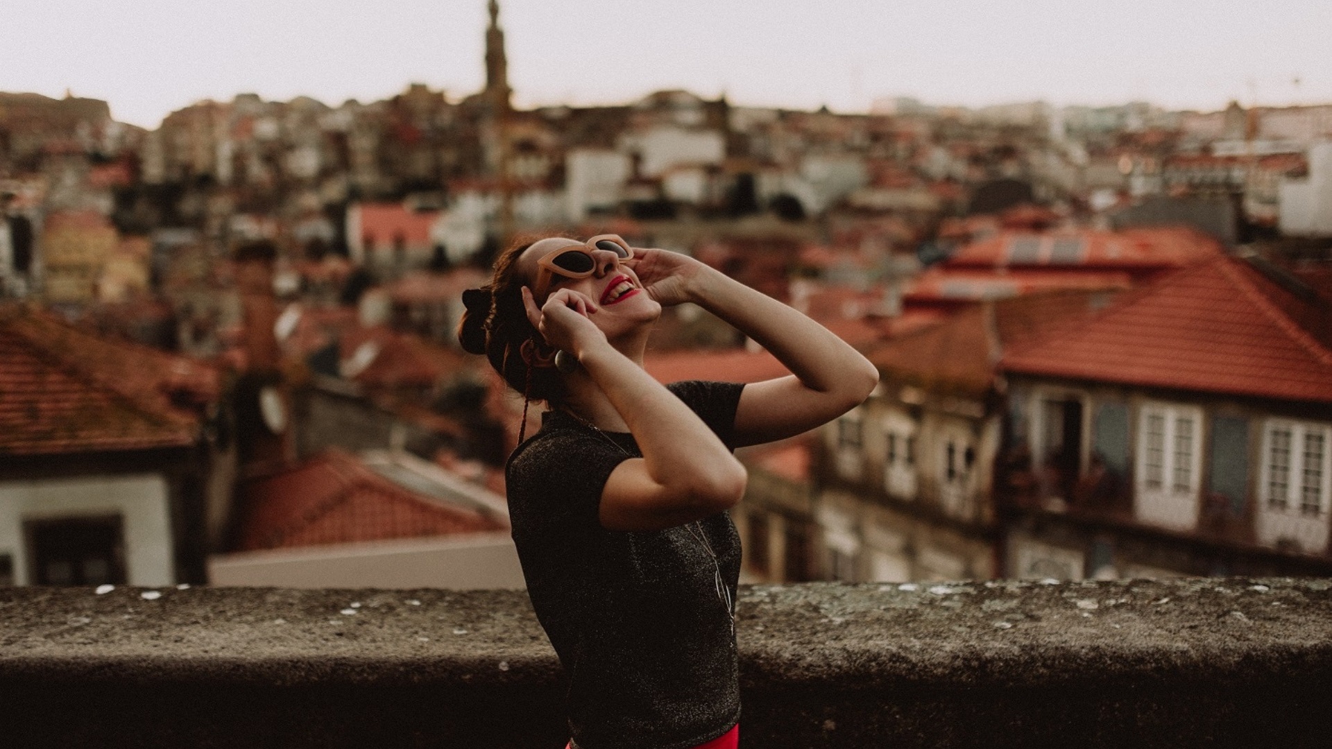 A happy woman looking at the sky
