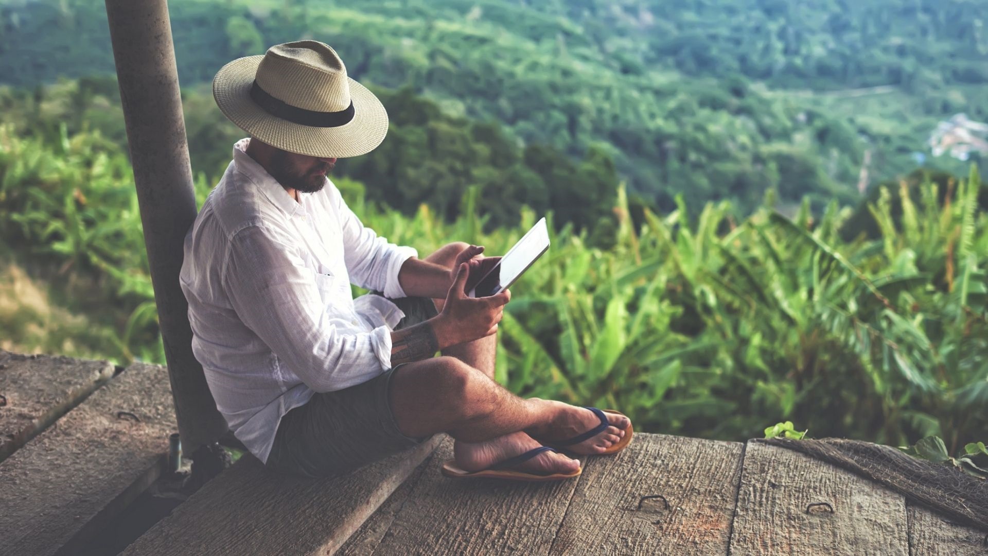 A man with his laptop and phone