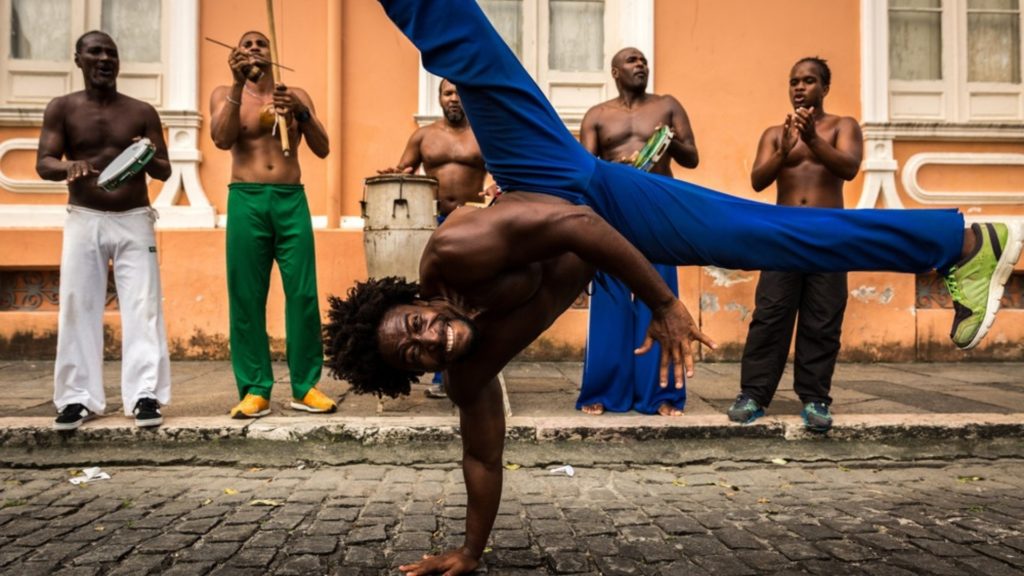 A man performing capoeira in Bahia, Brazil