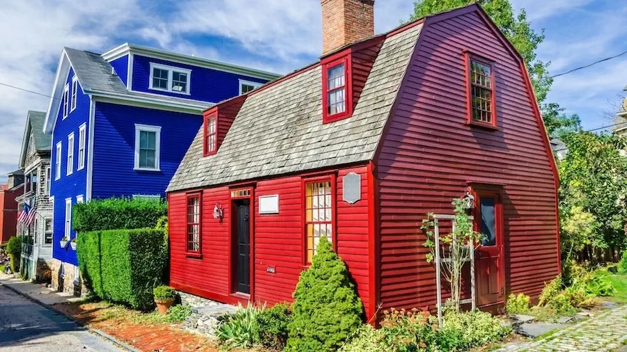 A blue and a red wooden building in Newport Rhode Island