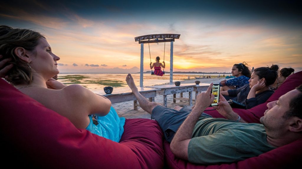 Travellers on a beach in Bali