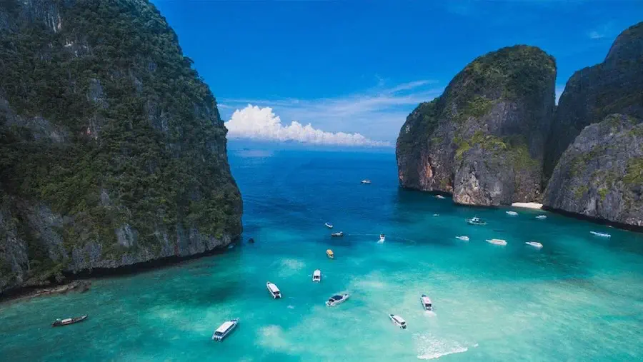 Boats sailing around the blue seas of Khao Sok National Park