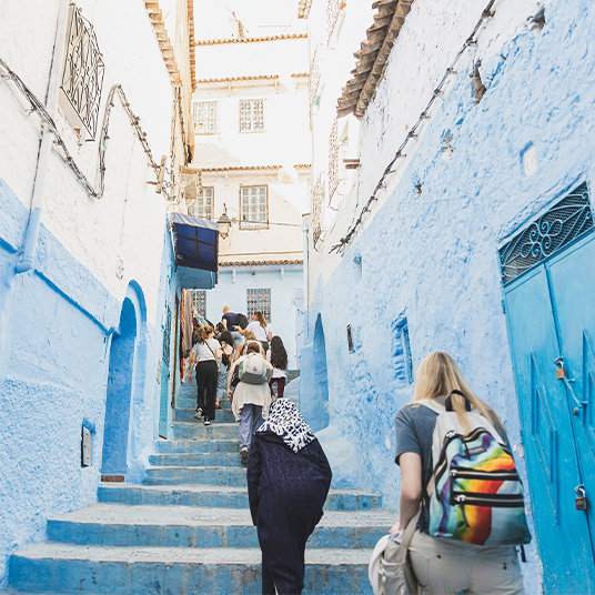 People climbing up the streets in Morocco