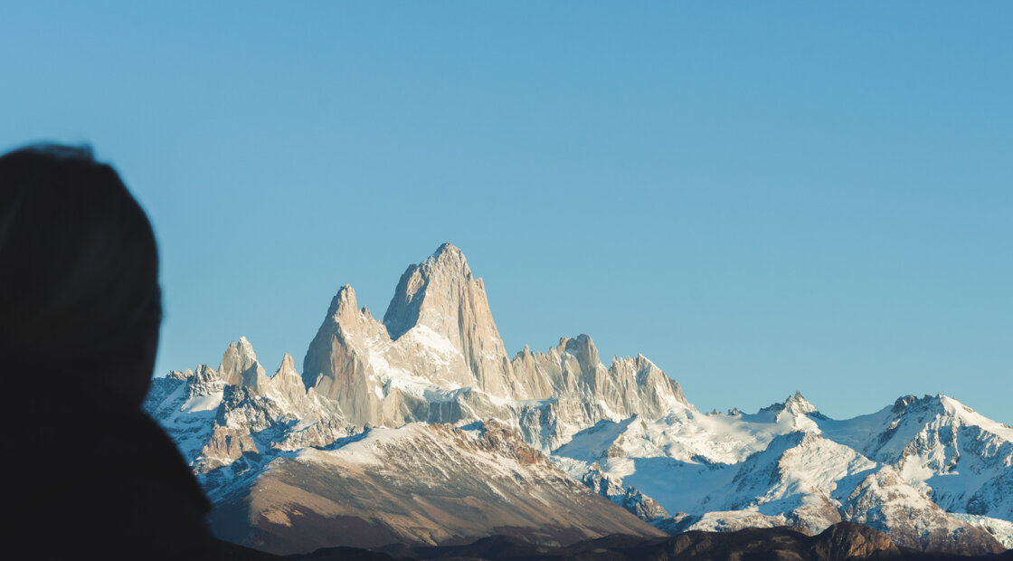 Silhoutte of a person in front of the Andes mountain range in Argentina