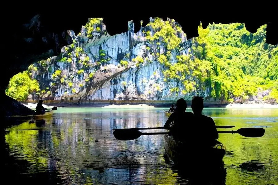 A silhouette of kayakers in Ha Long Bay, Vietnam